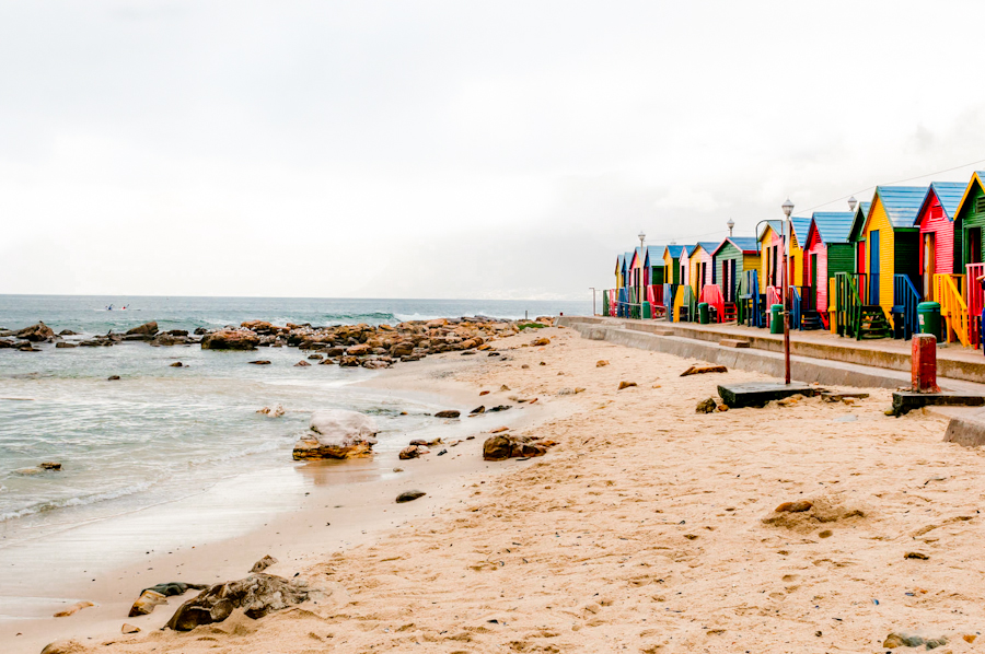 42314920 - multicoloured beach huts at st. james beach on a rainy morning